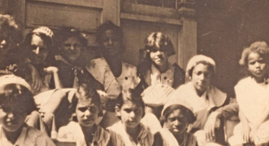 An image of the African Methodist Episcopal Mission Church at 156 Austin Street in Winnipeg, Manitoba. Young members of the church are pictured standing outside in front of the church.  Lena Robinson was the Director and Rev. Sineet and Rev. Romaine were co-Pastors. University of Winnipeg Archives, Western Canada Pictorial Index, Frances Atwell Collection [A1311-39210].